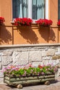 Traditional alpine houses with flowers on balcony, Cortina d'Amp Royalty Free Stock Photo