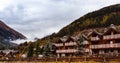 Traditional alpine houses in mountains, Dolomites Mountains, Italy Royalty Free Stock Photo