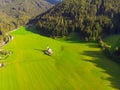 Santa Maddalena village in front of the Geisler or Odle Dolomites Group , Val di Funes, Italy, Europe. Green grass, blue sky and h Royalty Free Stock Photo