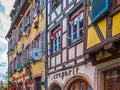 Traditional Alsatian buildings, with cheerful and romantic decorations on the facade, Colmar, France