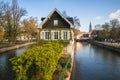 Traditional Alsatian half-timbered houses in Petite France, bridge and river embankment Ile during autumn day, Alsace, France