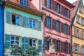 Traditional Alsatian house, with cheerful and romantic decorations on the facade, Colmar, France