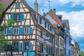 Traditional Alsatian house, with cheerful and romantic decorations on the facade, Colmar, France