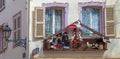 Traditional Alsatian house, with cheerful and romantic decorations on the facade, Colmar, France