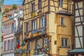 Traditional Alsatian house, with cheerful and romantic decorations on the facade, Colmar, France