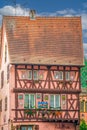 Traditional Alsatian house, with cheerful and romantic decorations on the facade, Colmar, France