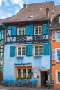 Traditional Alsatian restaurant, with cheerful and romantic decorations on the facade, Colmar, France