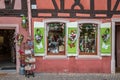 Traditional Alsatian souvenirs shop, with cheerful and romantic decorations on the facade, Colmar, France