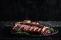 Traditional American barbecue dry aged steak sliced. porterhouse steak sliced as top view on a slate board. banner, catering menu Royalty Free Stock Photo