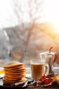 American breakfast of pumpkin pancakes and coffee on the window. Healthy delicious food Royalty Free Stock Photo