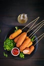 Traditional American corn dogs with mustard and ketchup Royalty Free Stock Photo