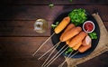 Traditional American corn dogs with mustard and ketchup Royalty Free Stock Photo