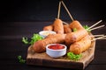 Traditional American corn dogs with mustard and ketchup Royalty Free Stock Photo