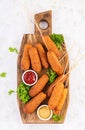 Traditional American corn dogs with mustard and ketchup Royalty Free Stock Photo