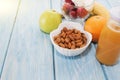 Traditional American and European summer Breakfast: berry, fruit Apple, strawberry, orange, banana. Light blue table. copy space.