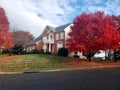 Traditional American residential house. Perfect neighbourhood in suburb, in North America. Luxury houses with nice landscapes Royalty Free Stock Photo