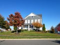 Traditional American residential house. Perfect neighbourhood in suburb, in North America. Luxury houses with nice landscapes Royalty Free Stock Photo