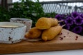 Traditional American street food corn dogs with mustard and ketchup on wooden table. Royalty Free Stock Photo