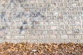 Traditional Ancient stone wall and Dry leaf, pattern and background, Korean style. Royalty Free Stock Photo