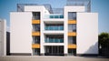 Traditional apartment building in mediterranian - exterior. Bright yellow and white facade with tall windows and long Royalty Free Stock Photo