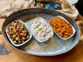 Traditional Appetizer Bulgur or Bulghur Kisir, Celery Salad and Chickpea Lentil Salad. Turkish Greek Food in Copper Tray at Local Royalty Free Stock Photo