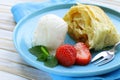 Traditional apple strudel with raisins, served with ice cream