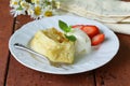 Traditional apple strudel with raisins, served with ice cream