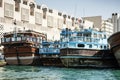 Traditional arabian dhow boats in deira harbour of dubai UAE