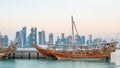 Traditional Arabic Dhow boats along with Doha skyline Royalty Free Stock Photo