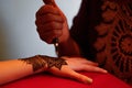 traditional Arabic henna drawing on hand of a young white girl in marrakech