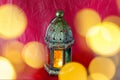Traditional arabic lantern lit up for celebrating holy month of Ramadan with bokeh lights Royalty Free Stock Photo