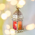 Traditional arabic lantern lit up for celebrating holy month of Ramadan with bokeh lights Royalty Free Stock Photo