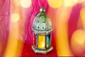 Traditional arabic lantern lit up for celebrating holy month of Ramadan with bokeh lights Royalty Free Stock Photo