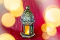 Traditional arabic lantern lit up for celebrating holy month of Ramadan with bokeh lights Royalty Free Stock Photo