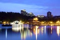 Traditional arch bridge and oriental pavilion by the lake Royalty Free Stock Photo