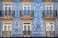 Traditional architecture of buildings with tiles in Porto Portugal. Blue facades with windows and balcony