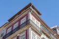 Traditional architecture with red-tiled walls, wrought iron balconies and embellished window frames, Porto, Portugal