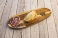 Traditional Argentine empanada stuffed with chicken with red onion and oregano with paprika