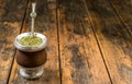 Traditional Argentinian yerba mate tea in a calabash gourd with bombilla stick. Royalty Free Stock Photo