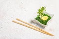 Traditional Asian chukka salad with peanut sauce in a bowl