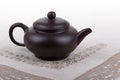Traditional asian clay teapot with lace doily.