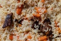 Traditional Asian culinary dish - pilaf. Close-up view of Eastern tasty food background