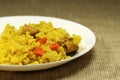 Traditional asian dish - pilaf from rice, vegetables and meat in a white plate. Royalty Free Stock Photo