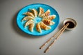 Traditional asian dumplings Gyozas on turqoise ceramic plate Royalty Free Stock Photo