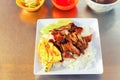 Traditional asian food. Fresh scrambled eggs with rice and barbecued meat