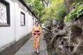 Traditional Asian Japanese beautiful woman wears kimono in a spring garden park stand by bamboo enjoy free time Royalty Free Stock Photo