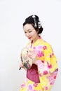 Traditional Asian Japanese woman with kimono with a fan on hand on isolated white background