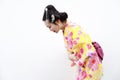 Traditional Asian Japanese woman with kimono respectful bow on isolated white background