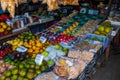 The traditional Asian market with food. Sale a variety of fruits lying on the counter. Malaysia