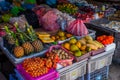 The traditional Asian market with food. Sale a variety of fruits lying on the counter. Malaysia